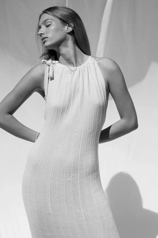 One-size pleated knitted dress made using a zero waste technique. Designed to embrace all body shapes with fluidity and elegance.
